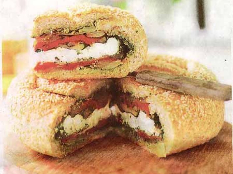 Stuffed picnic sandwich with goat cheese